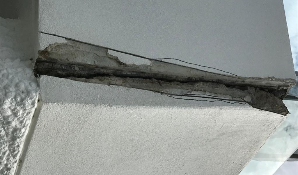 Control joint repair on a concrete slab